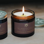 The Botanical Candle Co. Mediterranean Clementine & Rosewood natural soy candle in a reusable amber glass jar, hand-poured in England.




