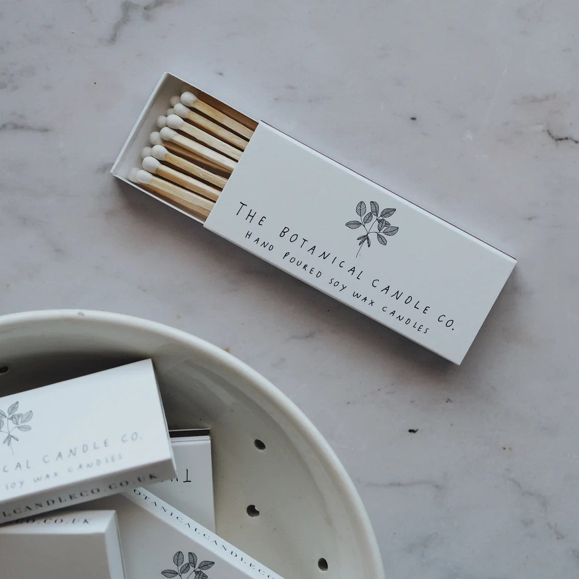 The Botanical Candle Co. Mini Box of Matches with 15 extra-long white-tipped matches in a beautifully illustrated decorative box for lighting candles.
