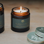 The Botanical Candle Co. Neroli & Bitter Orange natural soy candle in a reusable amber glass jar, hand-poured in England with citrus and floral essential oils.