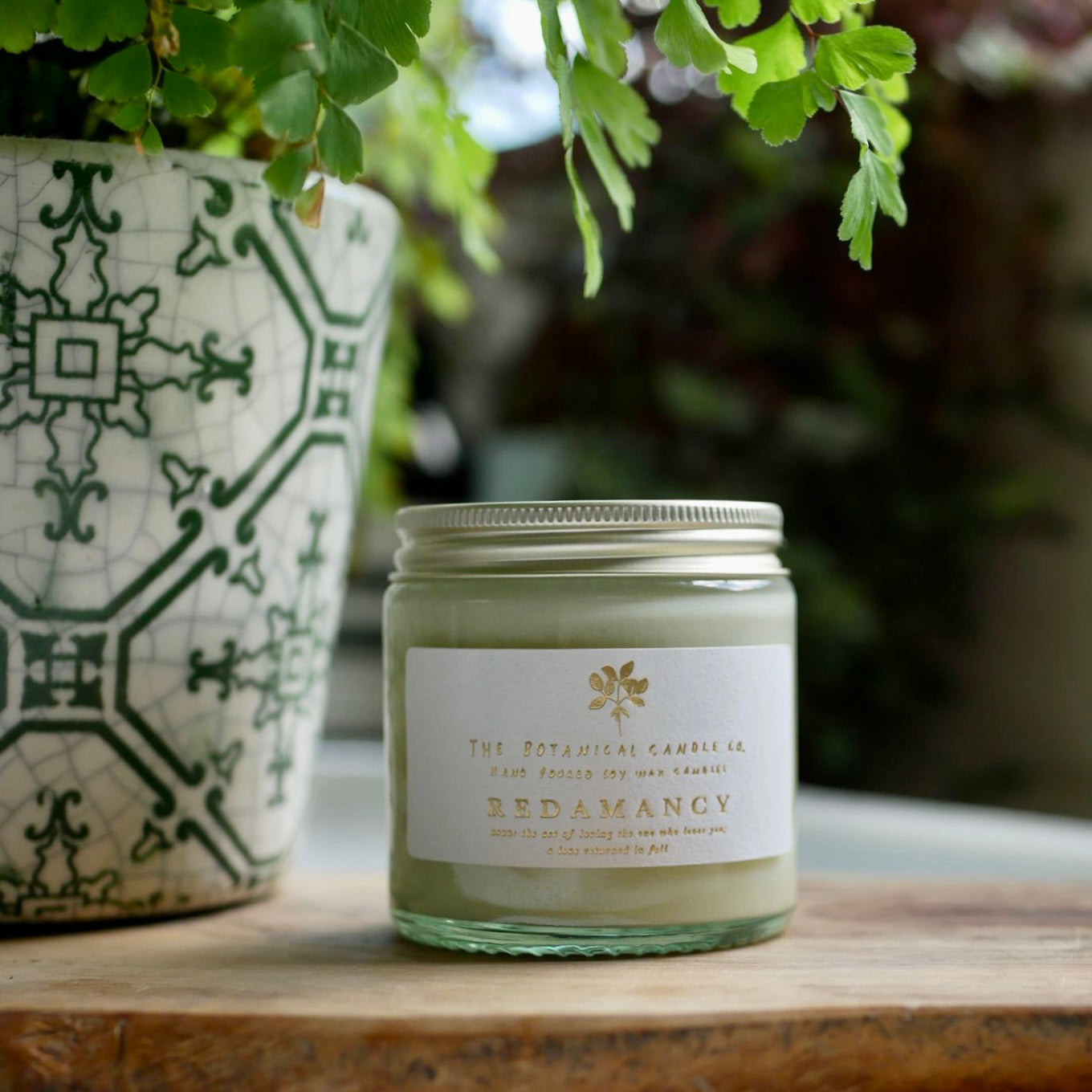 The Botanical Candle Co. Redamancy natural soy candle hand-poured in England with patchouli, rose geranium and frankincense fragrance.