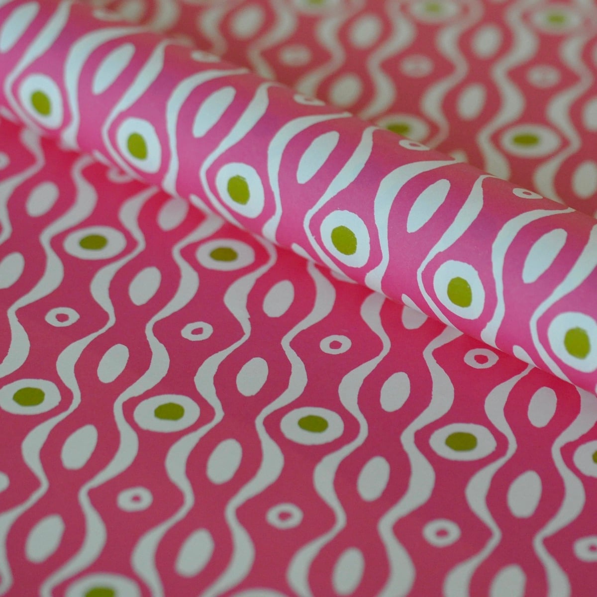 Shop Cambridge Imprint Persephone wrapping paper in Shocking Pink & Lettuce. A bold Bloomsbury-inspired luxury gift wrap printed in England.
