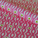 Shop Cambridge Imprint Persephone wrapping paper in Shocking Pink & Lettuce. A bold Bloomsbury-inspired luxury gift wrap printed in England.