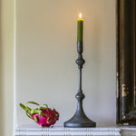 Elongated antique black metal candlestick with an intricate diamond base. A timeless, elegant accent that suits both classic and modern interiors.