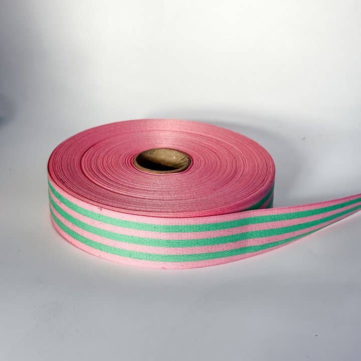 Candy pink and grass green multistripe cotton ribbon, 35mm wide, for colourful gift wrapping, statement bows and creative crafts.