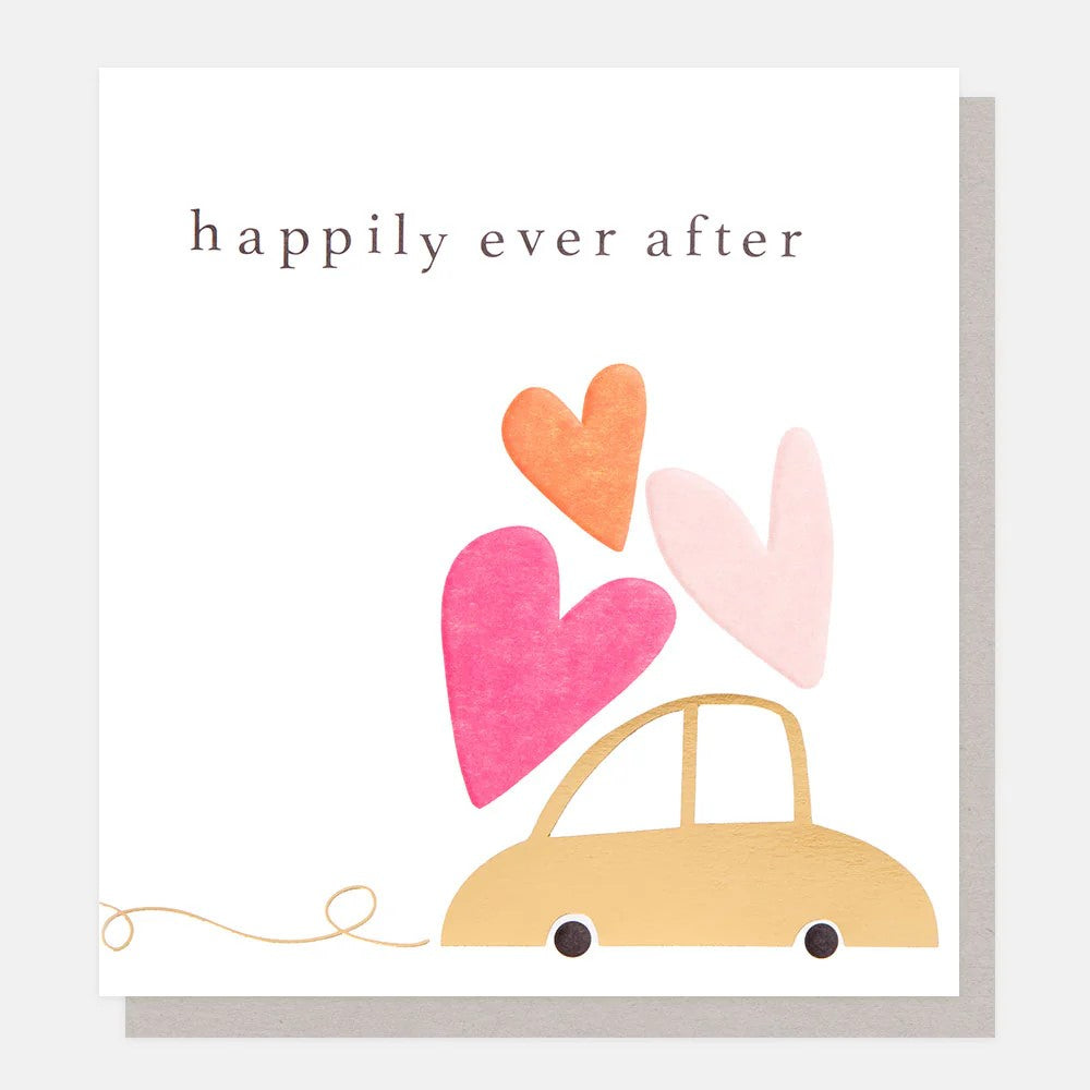 Wedding congratulations card featuring an illustrated wedding car with floating hearts and the words Happily Ever After, finished with gold foil and embossing.