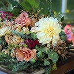 Natural hand-tied seasonal funeral sheaf with garden-style flowers and fresh foliage, handcrafted by Mad Lilies florists in Banstead, Surrey.