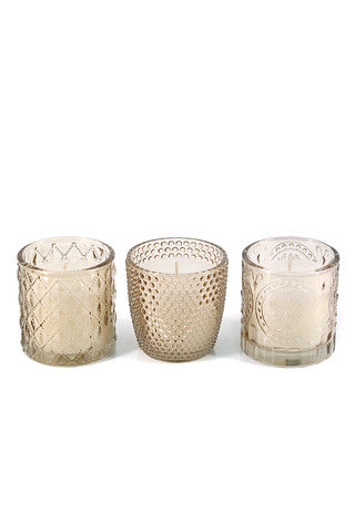 Elegant champagne glass votive with white unscented candle. Perfect for weddings, table styling, and home décor. Approx. 15hr burn time.