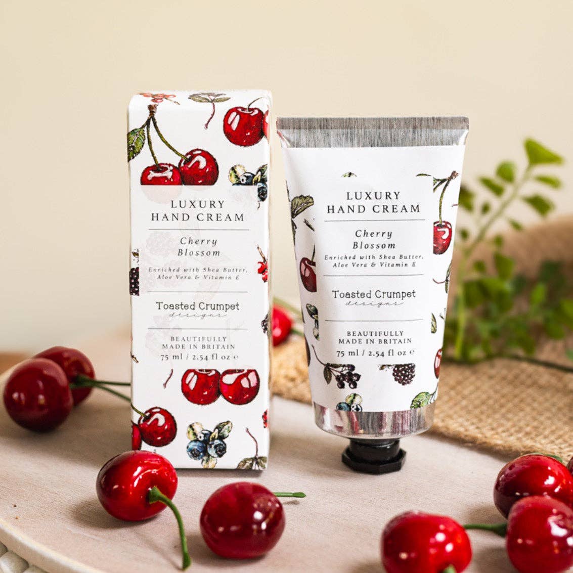 Cherry Blossom luxury hand cream in a recyclable aluminium tube with shea butter, aloe vera and vitamin E, presented in an illustrated gift box and made in Britain.