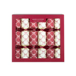 Christmas crackers decorated with bows and containing handcrafted wooden Christmas tree ornaments.