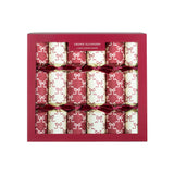 Christmas crackers decorated with bows and containing handcrafted wooden Christmas tree ornaments.