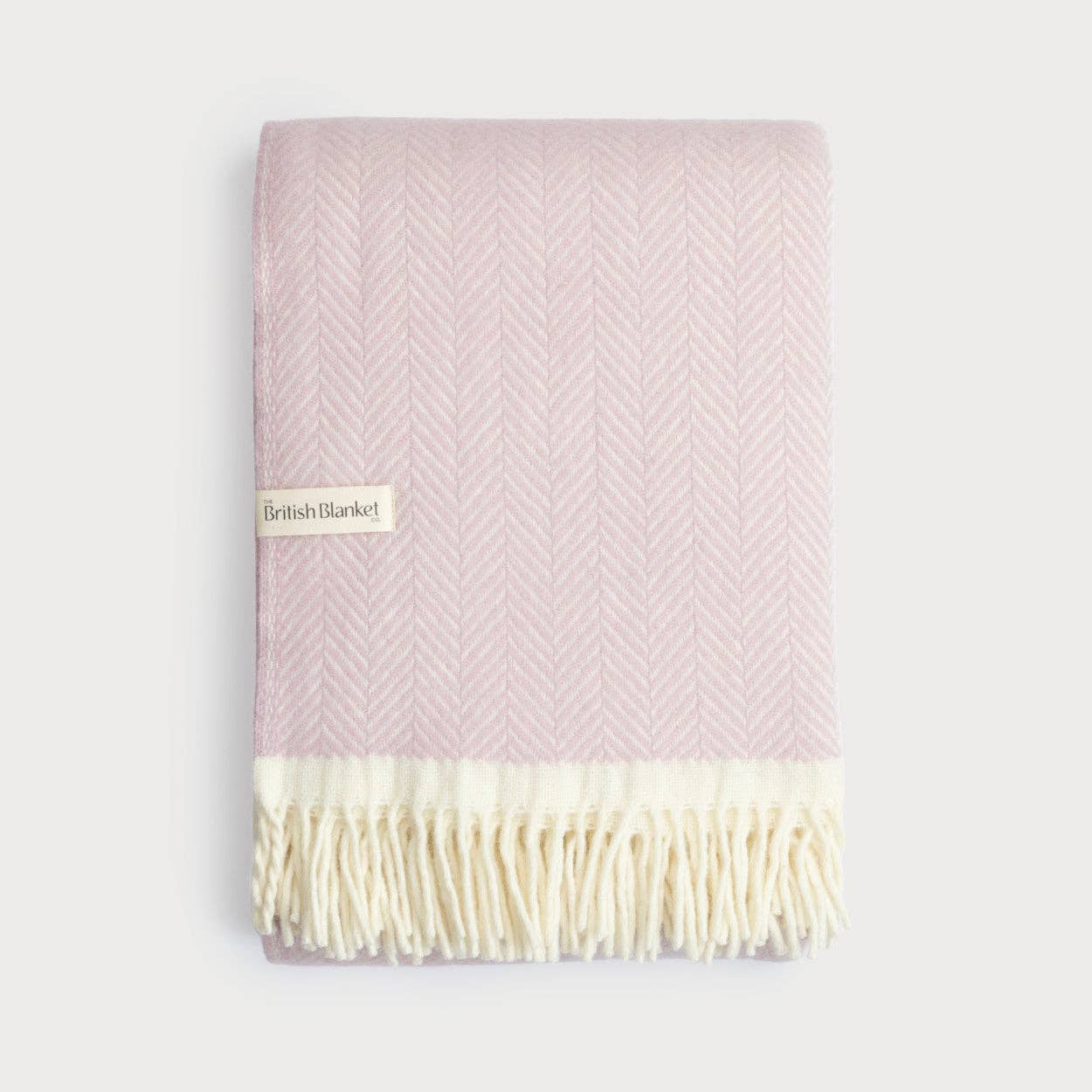 Clifton Polygon soft pink herringbone pure wool blanket with ivory tassels