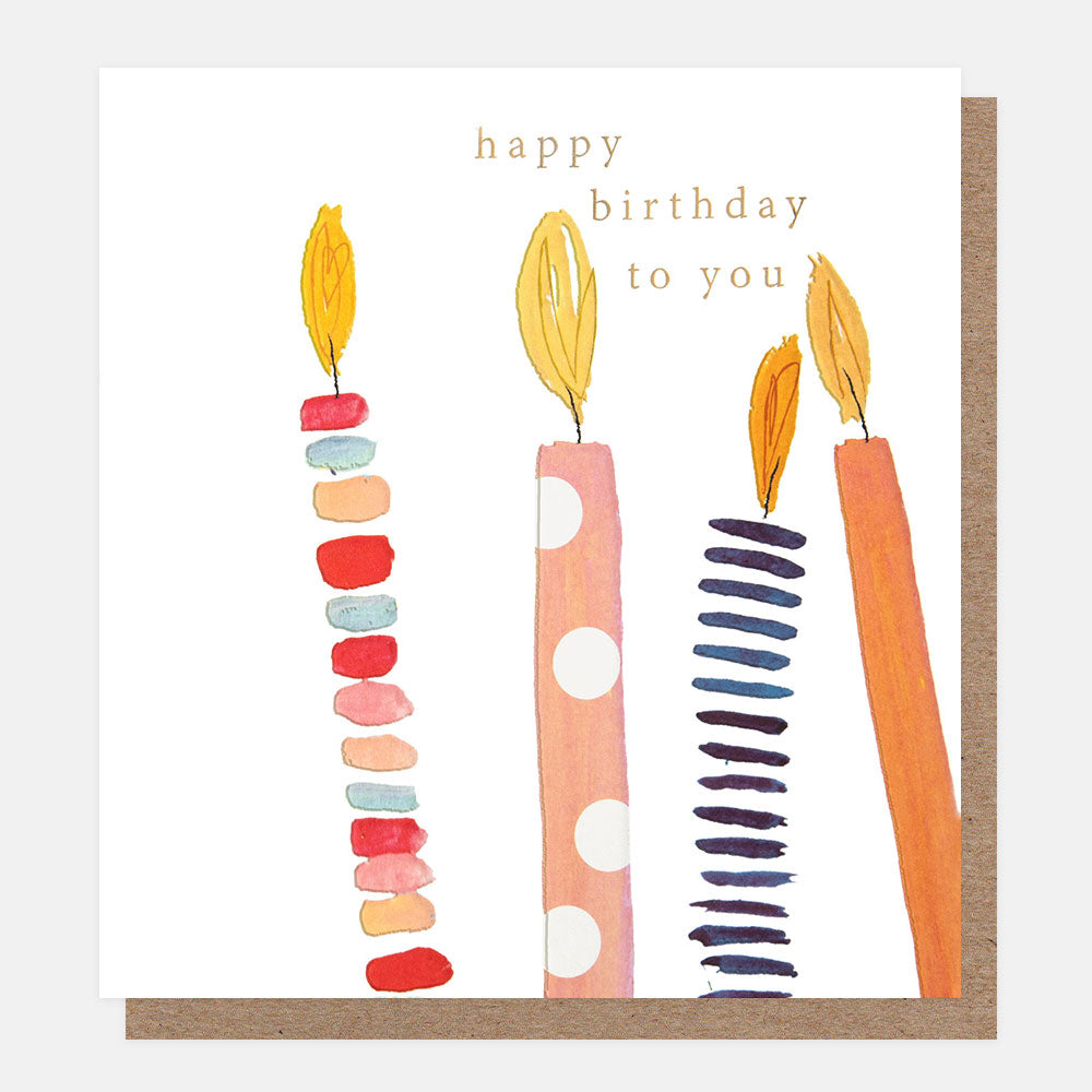 Colourful birthday card featuring hand-drawn candles decorated with spots and stripes, embossed details and gold foil.