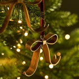 Shop three Cromwell Christmas Bow Decorations in antique brass, finished with berry velvet hangers. Perfect for Christmas trees, garlands and wreaths.