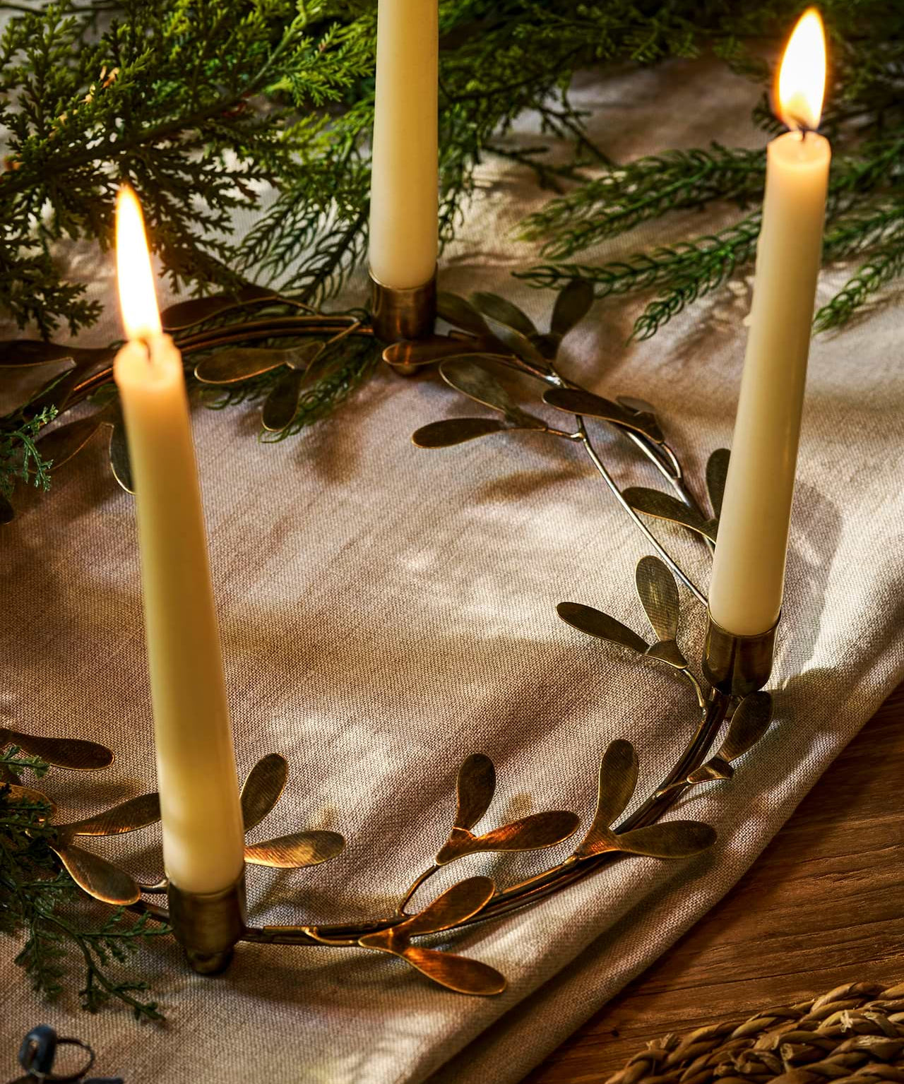 Brass mistletoe Christmas candle ring centrepiece holding four dinner candles