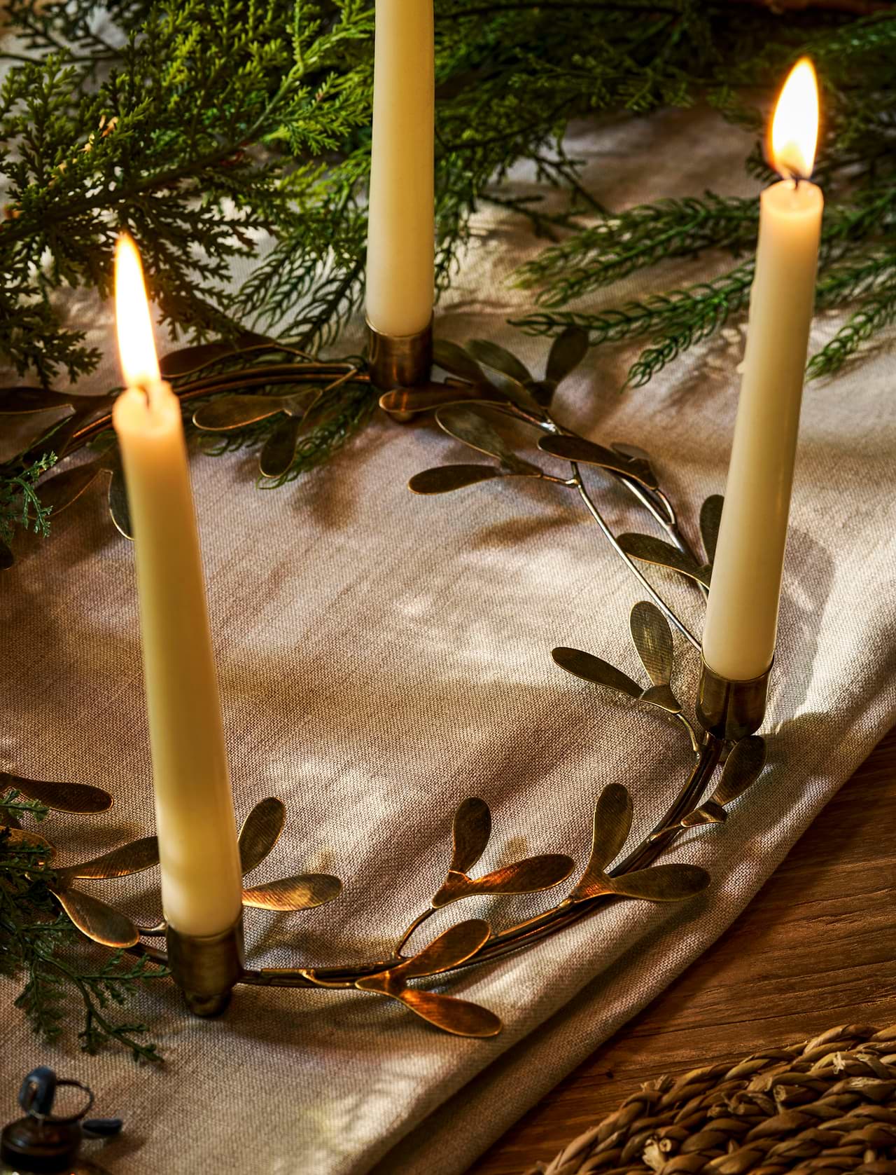 Brass mistletoe Christmas candle ring centrepiece holding four dinner candles
