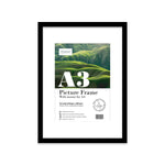 Modern black photo frame with white mount on gallery wall