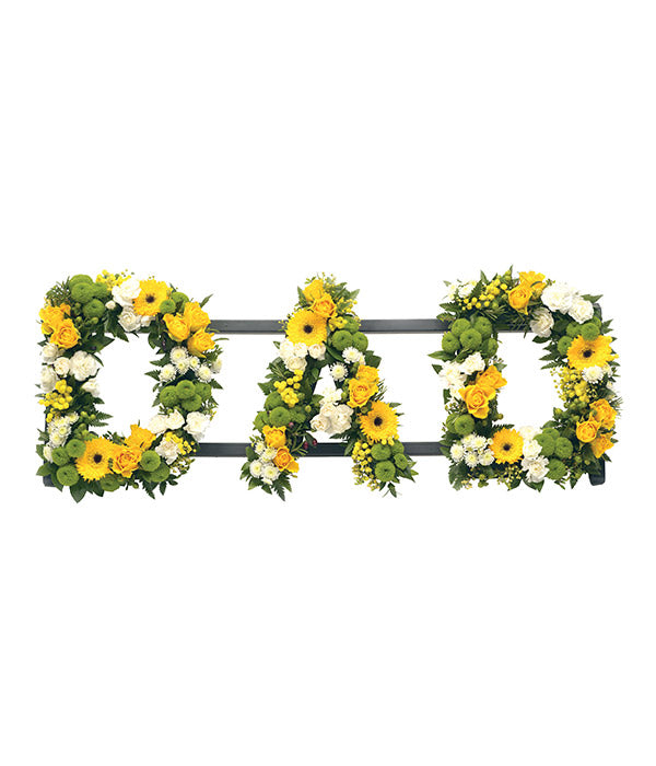 DAD funeral flower letter tribute handcrafted by Mad Lilies in Banstead, Surrey, featuring beautiful seasonal flowers arranged with care and sensitivity.