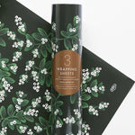 Shop Rifle Paper Co. Evergreen Mistletoe Christmas Wrapping Paper. Three 500 × 700mm sheets, beautifully rolled and wrapped in a fourth festive sheet.