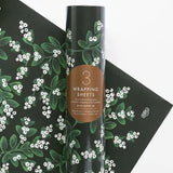 Shop Rifle Paper Co. Evergreen Mistletoe Christmas Wrapping Paper. Three 500 × 700mm sheets, beautifully rolled and wrapped in a fourth festive sheet.