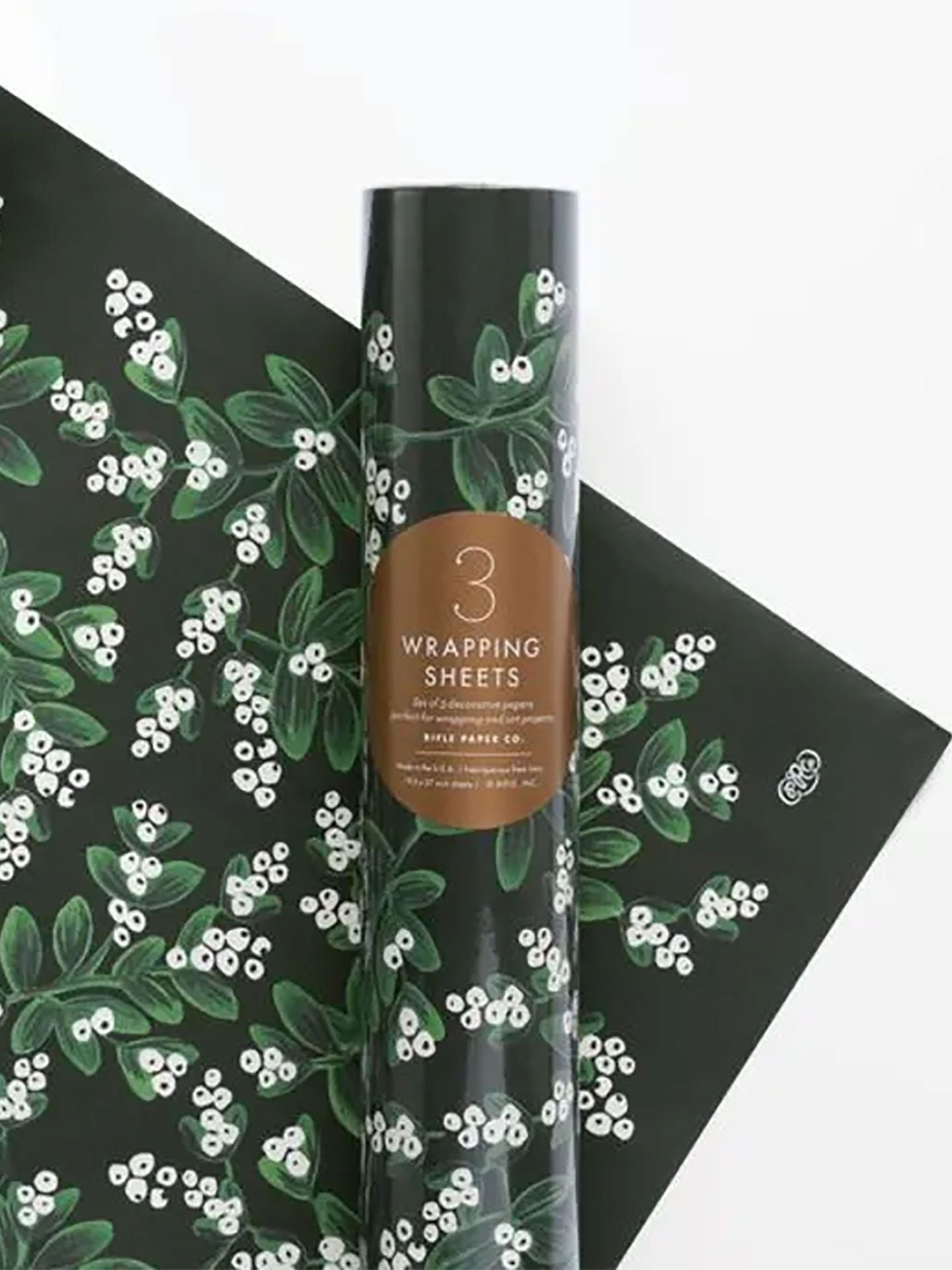 Shop Rifle Paper Co. Evergreen Mistletoe Christmas Wrapping Paper. Three 500 × 700mm sheets, beautifully rolled and wrapped in a fourth festive sheet.