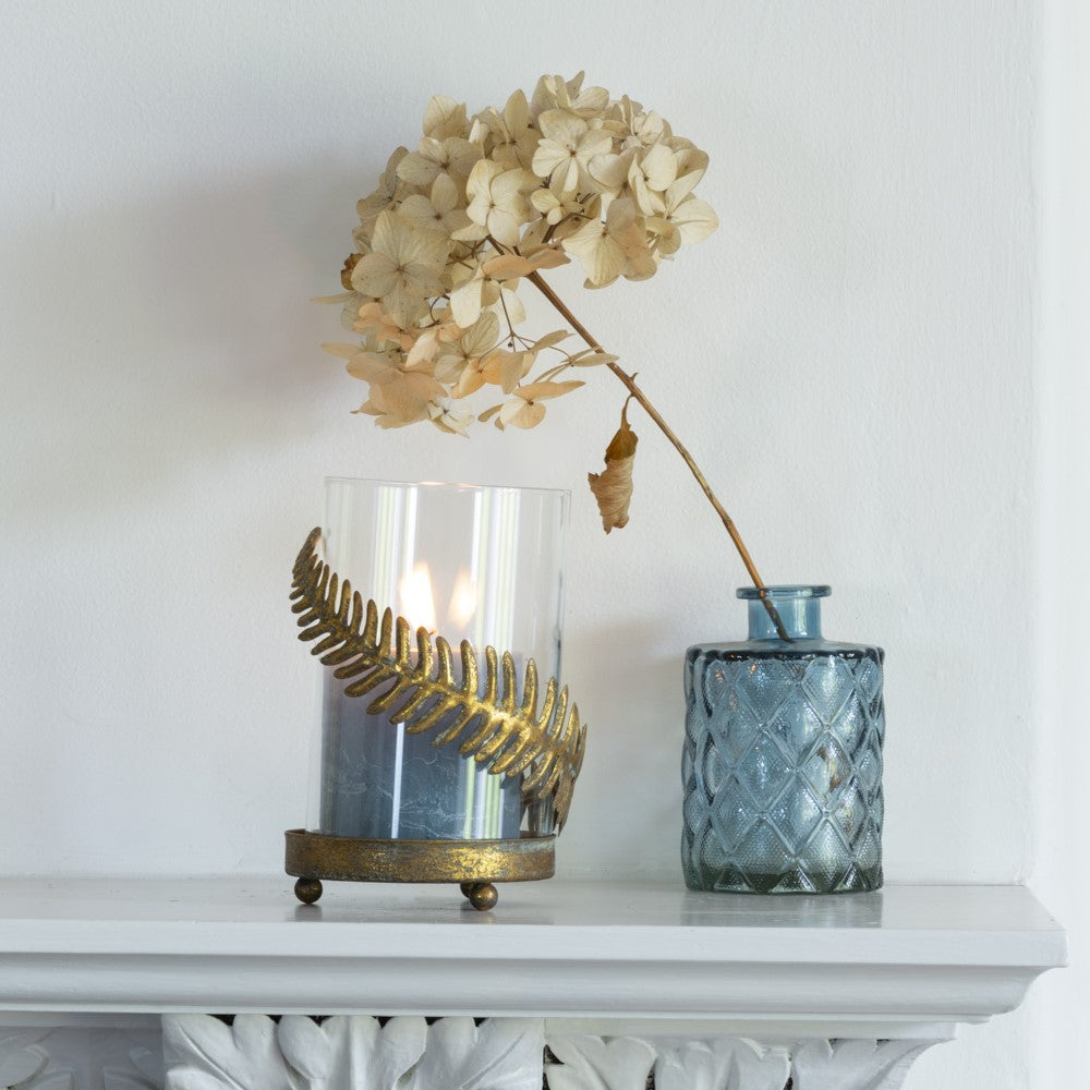 Fern Leaf Hurricane Lamp with clear glass and decorative gold fern detailing.