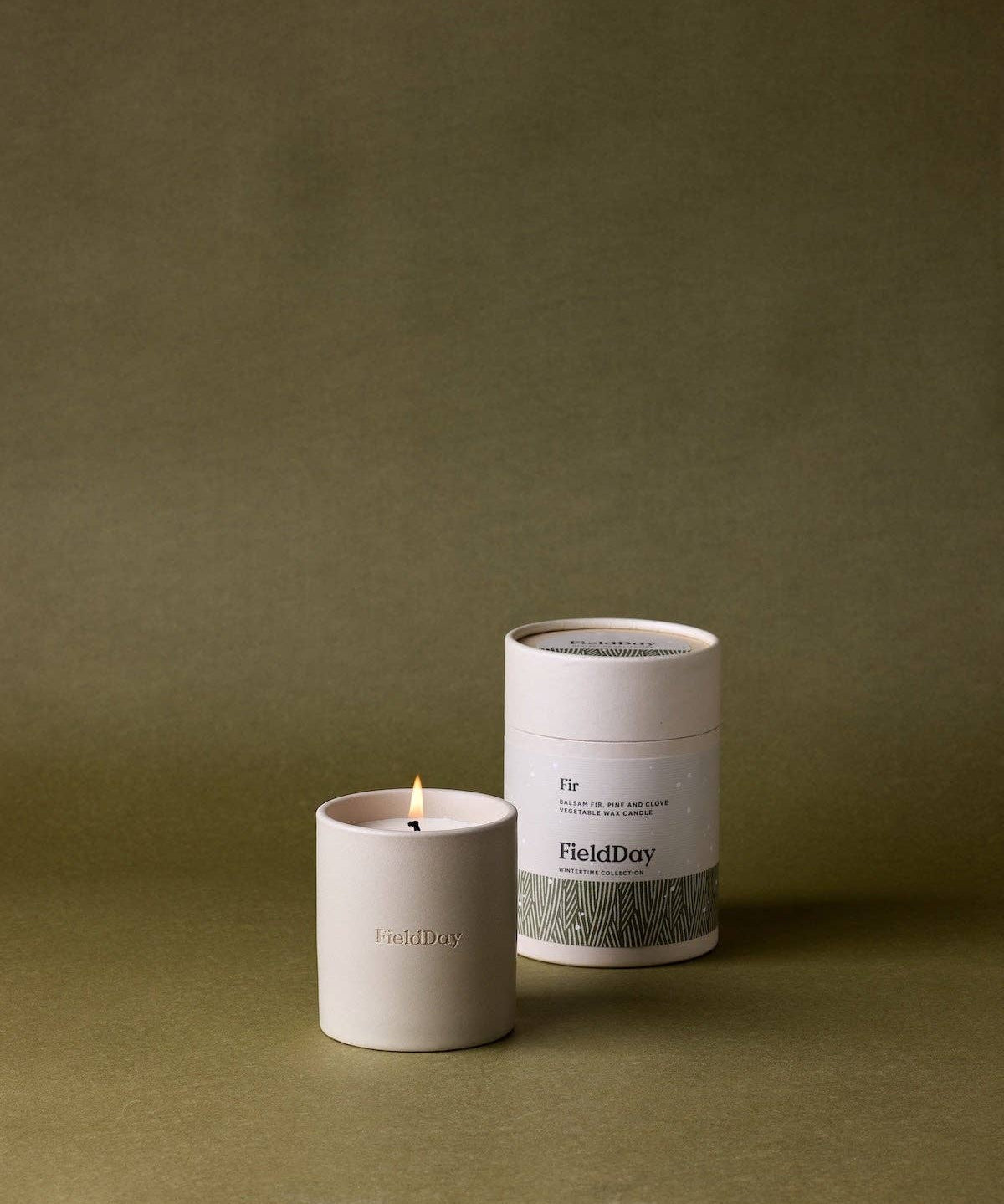 FieldDay Fir Classic scented candle in a stoneware pot, presented in a branded cotton bag and gift tube, with balsam fir, pine and clove fragrance.