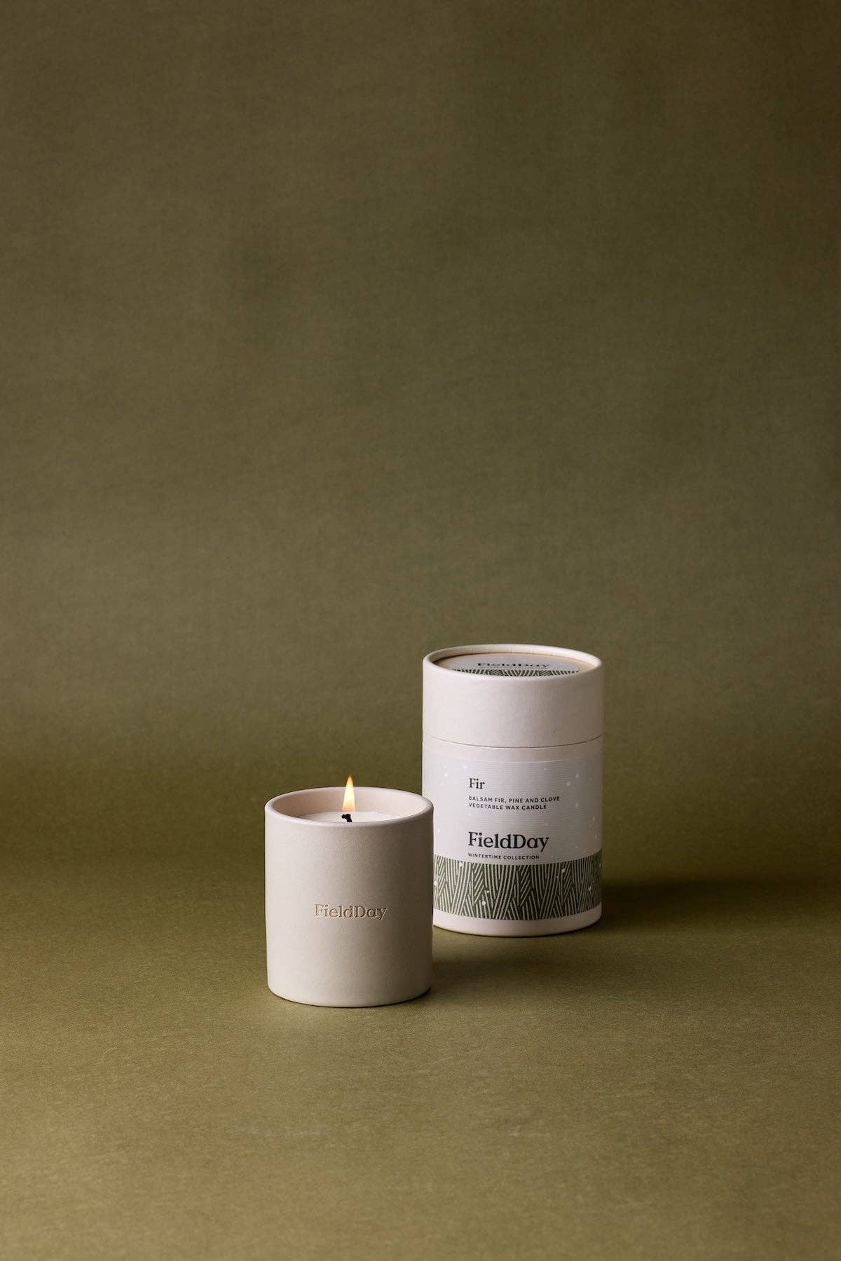 FieldDay Fir Classic scented candle in a stoneware pot, presented in a branded cotton bag and gift tube, with balsam fir, pine and clove fragrance.