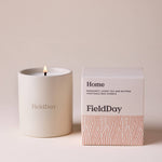 FieldDay Home scented candle in a reusable stoneware pot with bergamot, loose tea and nutmeg fragrance.