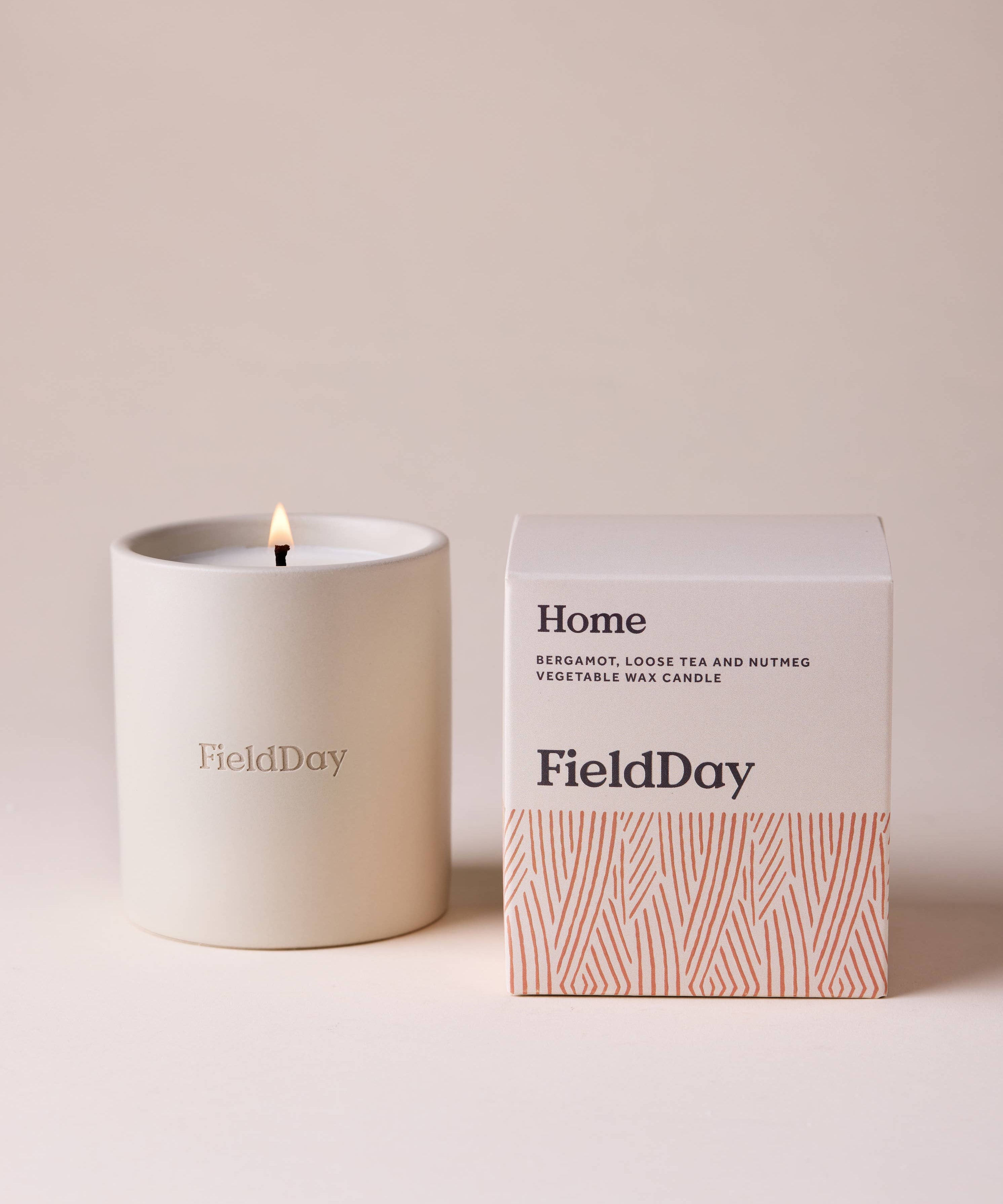 FieldDay Home scented candle in a reusable stoneware pot with bergamot, loose tea and nutmeg fragrance.