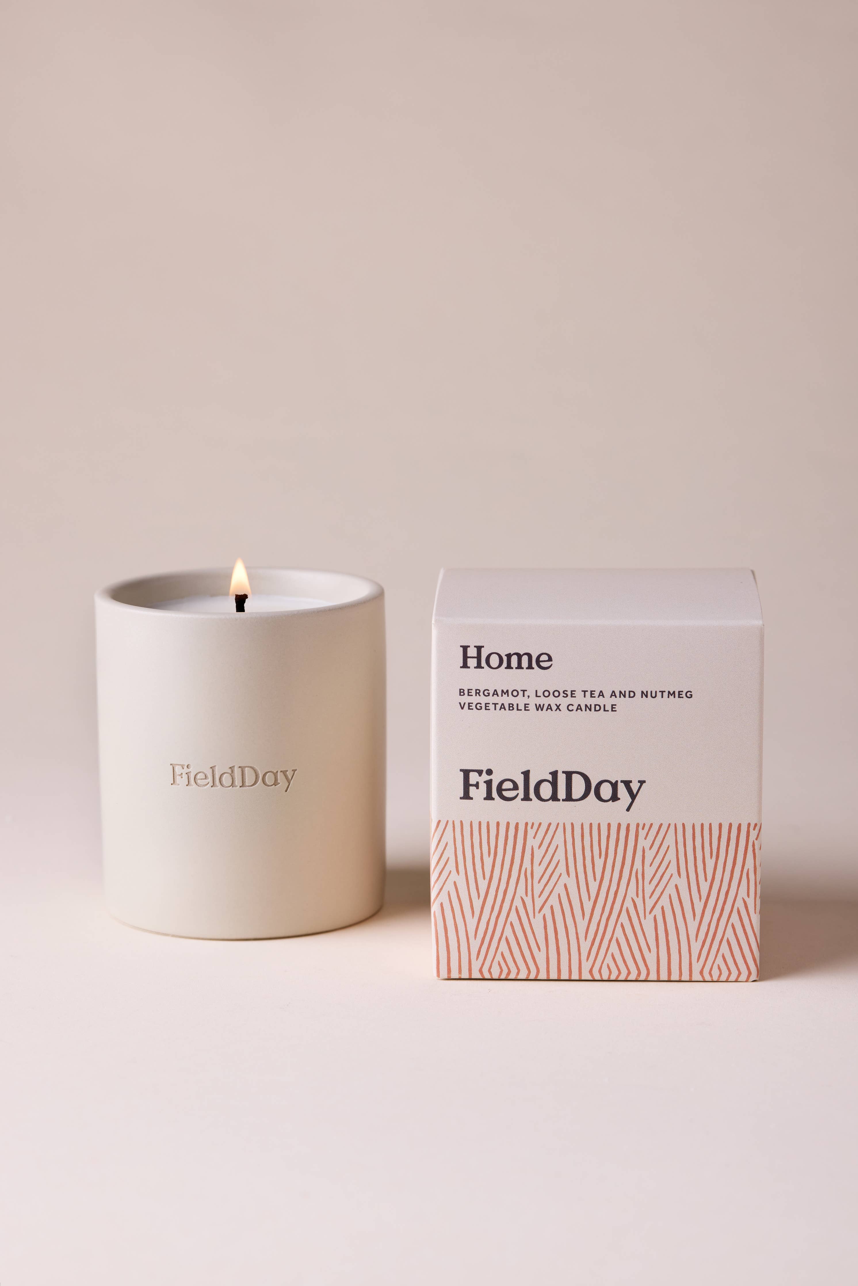 FieldDay Home scented candle in a reusable stoneware pot with bergamot, loose tea and nutmeg fragrance.
