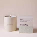 FieldDay Sea scented candle in a reusable stoneware pot with salt air, lemon and sandalwood fragrance.