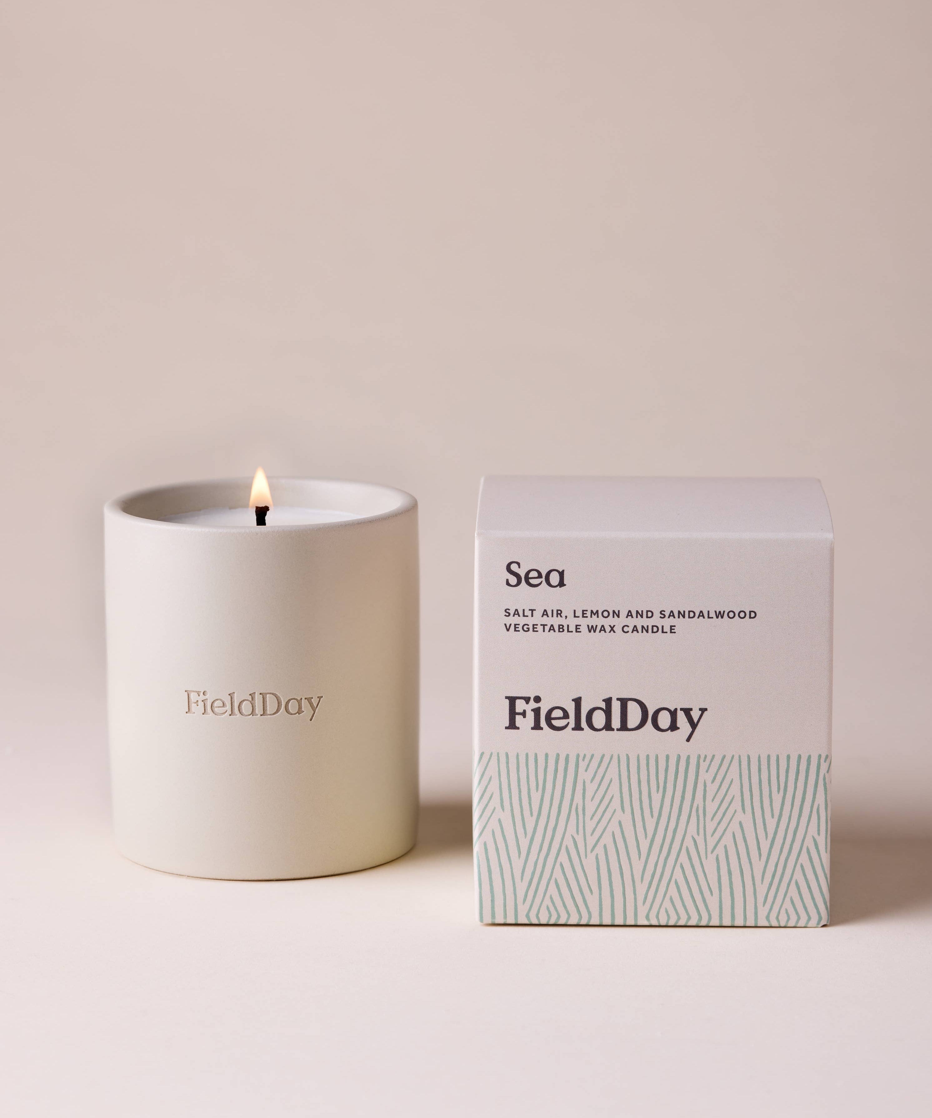 FieldDay Sea scented candle in a reusable stoneware pot with salt air, lemon and sandalwood fragrance.