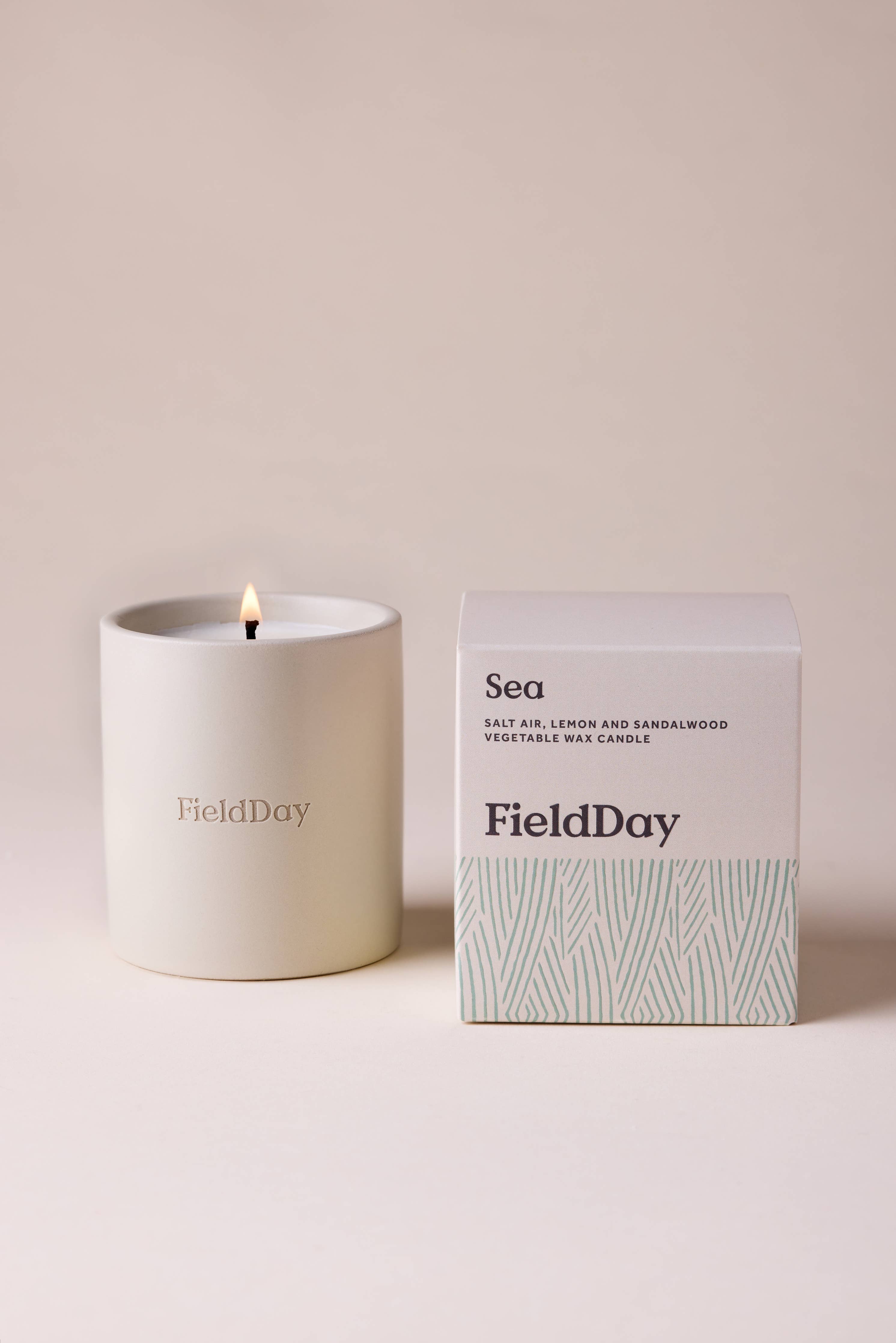 FieldDay Sea scented candle in a reusable stoneware pot with salt air, lemon and sandalwood fragrance.