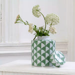 Elegant green and white ceramic ginger jar with a contemporary patterned design. Perfect as a decorative statement piece for shelves, consoles and interiors.