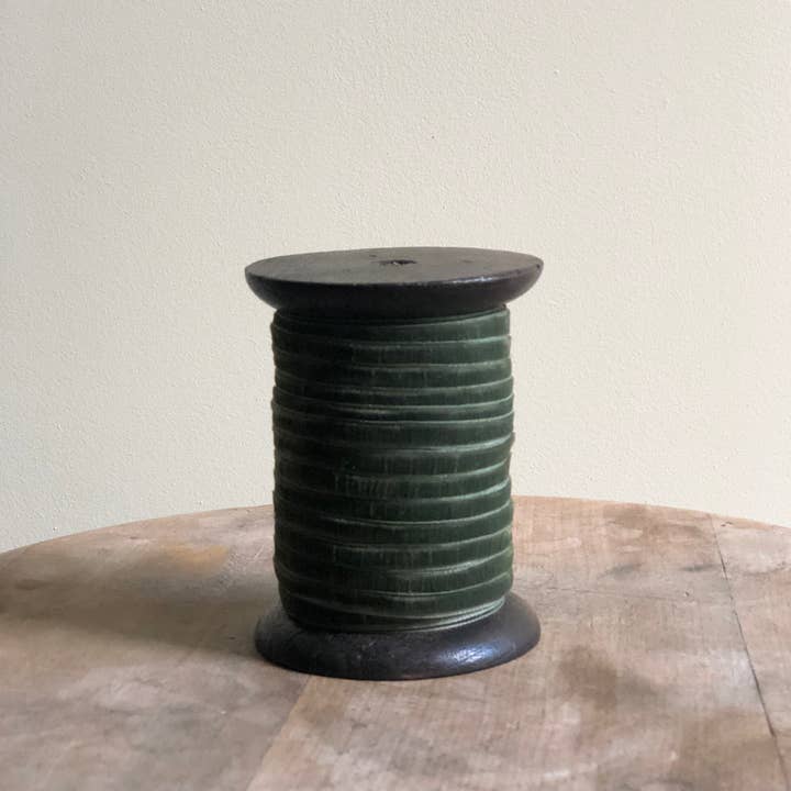 Forest Green narrow velvet ribbon, 6mm wide and 10 metres long, wound onto a wooden spool for gift wrapping and Christmas crafting