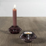 Mini ribbed amethyst glass votives for tealights or dinner candles. Their textured design gives a cosy glow and looks beautiful mixed with other colours.