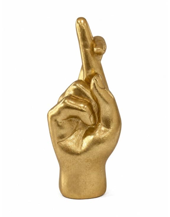 Gold decorative hand figure with fingers crossed, styled as a quirky good luck ornament for the home.