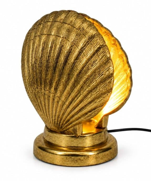 Gold Shell Table Lamp featuring a sculptural shell design and warm ambient lighting for stylish interiors.