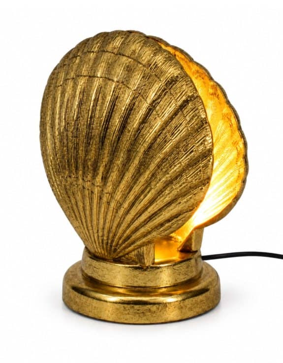 Gold Shell Table Lamp featuring a sculptural shell design and warm ambient lighting for stylish interiors.