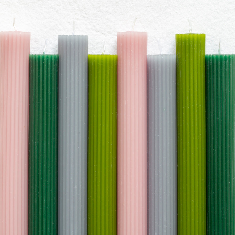 Elegant scalloped dinner candles by Grand Illusions with a smooth wax finish and long burn time. Decorative taper candles perfect for tablescapes and entertaining.