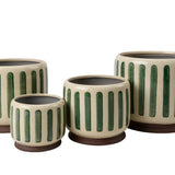 Green crackle glaze stoneware plant pot with subtle striped texture and integrated stand for styling indoor houseplants.