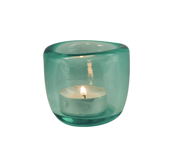 Hand-blown coloured glass tealight holder available in blue, green and orange, creating a warm jewel-like glow when illuminated with a tealight candle.
