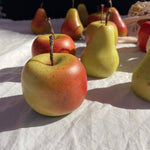 Hand-painted apple-shaped soy wax candle with realistic detailing, individually finished by hand.