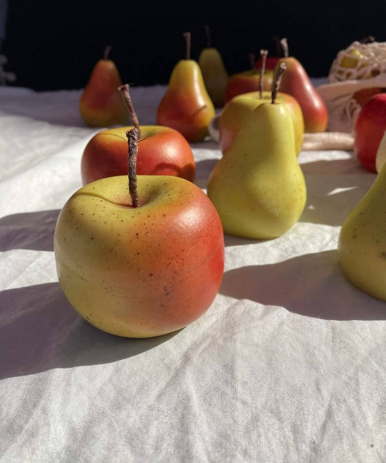 Hand-painted apple-shaped soy wax candle with realistic detailing, individually finished by hand.