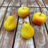 Small hand-painted pear-shaped candle handmade from 100% soy wax with realistic detailing.