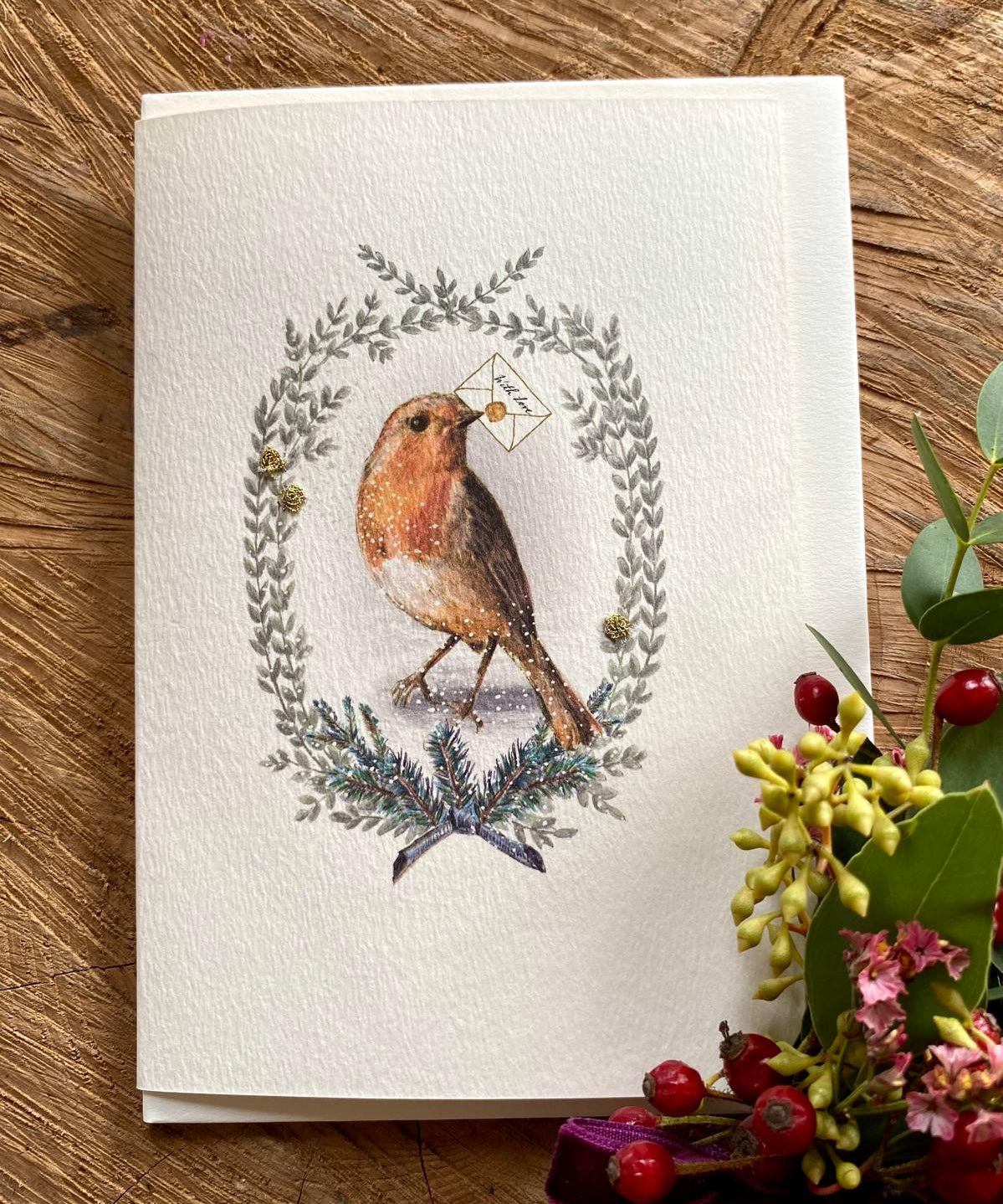 Handmade Painted Robin Christmas card featuring original artwork by Elena Deshmukh, individually hand stitched on premium textured cardstock.