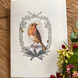 Handmade Painted Robin Christmas card featuring original artwork by Elena Deshmukh, individually hand stitched on premium textured cardstock.