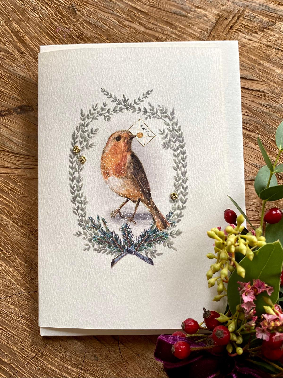 Handmade Painted Robin Christmas card featuring original artwork by Elena Deshmukh, individually hand stitched on premium textured cardstock.