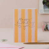 Happy Birthday To You mustard stripe card with rose gold foil lettering by Oh Squirrel.
