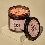 Relax and unwind with Happy Space Bath Salts. Mineral-rich Himalayan and Epsom salts with rose, geranium and amber to soothe body and mind.